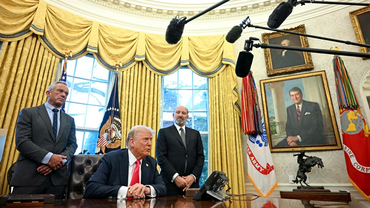 US President Donald Trump speaks to the press after signing an Executive Order, alongside US Secretary of Health and Human Services Robert F. Kennedy Jr. (L) and US Secretary of Commerce nominee Howard Lutnick (R), at the Oval Office of the White House in Washington, DC on February 25, 2025. Trump signed an executive order on price transparency requirements on the health care industry to reinstate and strengthen them. He also signed an order on the supply of copper and foreign copper in the American market, the order charges Lutnick with looking at process to potentially impose tariffs or trade barriers. (Photo by Jim WATSON / AFP) (Photo by JIM WATSON/AFP via Getty Images)          