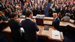 President Donald Trump is applauded by Vice President JD Vance and House Speaker Mike Johnson as he arrives to deliver his address to a joint session of Congress at the US Capitol in Washington, DC, on March 4.