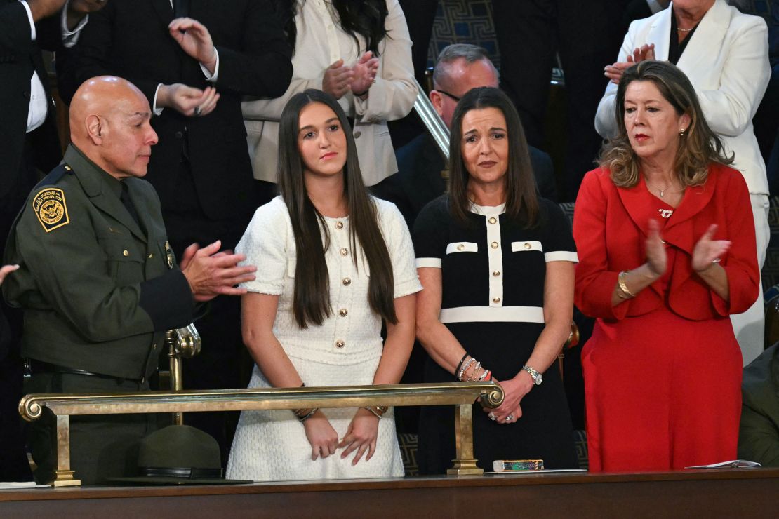 Allyson and Lauren Phillips, mother and sister of the late Laken Riley stand as they are recognized by President Donald Trump.