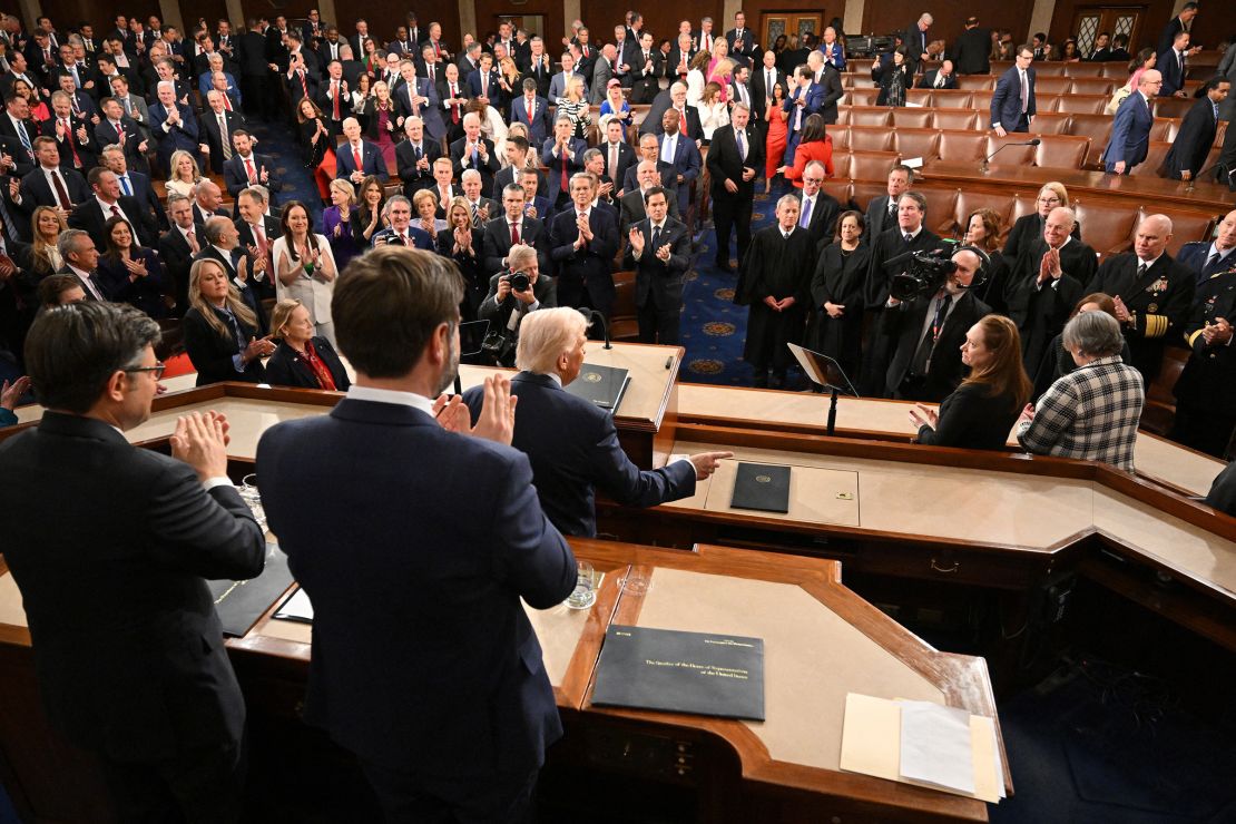 Republican lawmakers stand to applaud as Democrats leave their seats after US President Donald Trump delivered his address to a joint session of Congress at the US Capitol in Washington, DC, on March 4.