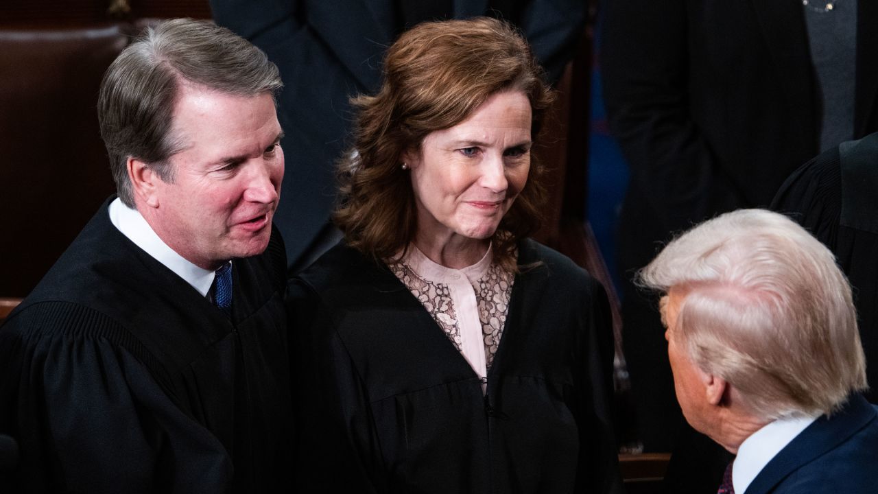 Supreme Court Justices Brett Kavanaugh and Amy Coney Barrett greet President Donald Trump after his address to a joint session of Congress at the US Capitol on March 4.