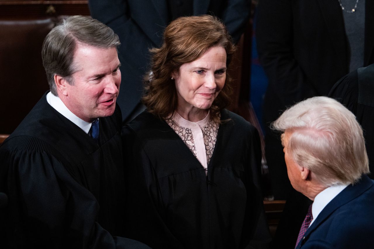 Supreme Court Justices Brett Kavanaugh and Amy Coney Barrett greet President Donald Trump after his address to a joint session of Congress at the US Capitol on March 4.