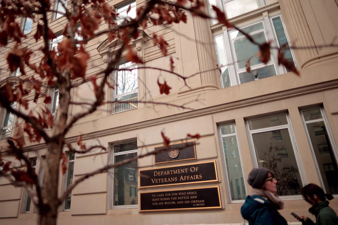 People walk past the Department of Veterans Affairs headquarters a block from the White House on March 6 in Washington, DC.