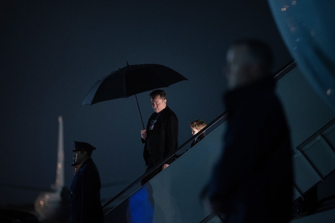Elon Musk and his son X Æ A-12 step off of Air Force One upon arrival at Joint Base Andrews in Maryland, on March 17.