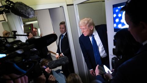 President Donald Trump speaks to reporters aboard Air Force One while flying to Washington, DC, from Florida, on March 16.