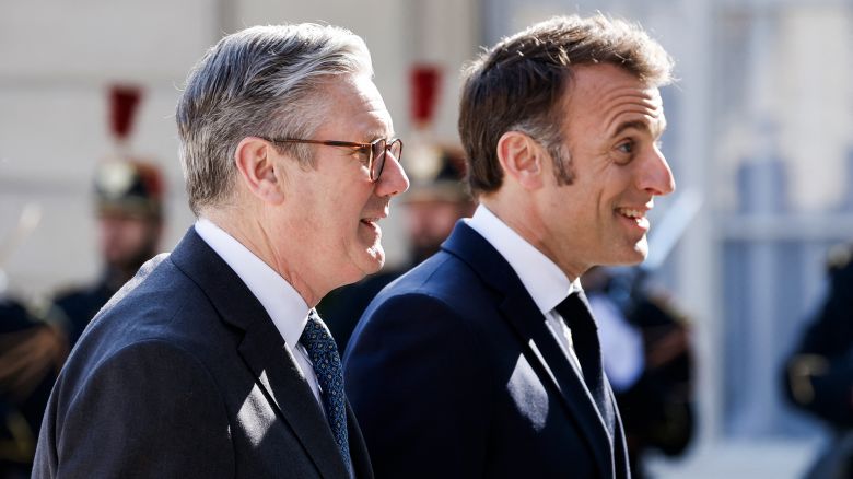 France's President Emmanuel Macron welcomes Britain's Prime Minister Keir Starmer as he arrives for a summit for "coalition of the willing" at the Elysee Palace, on March 27.