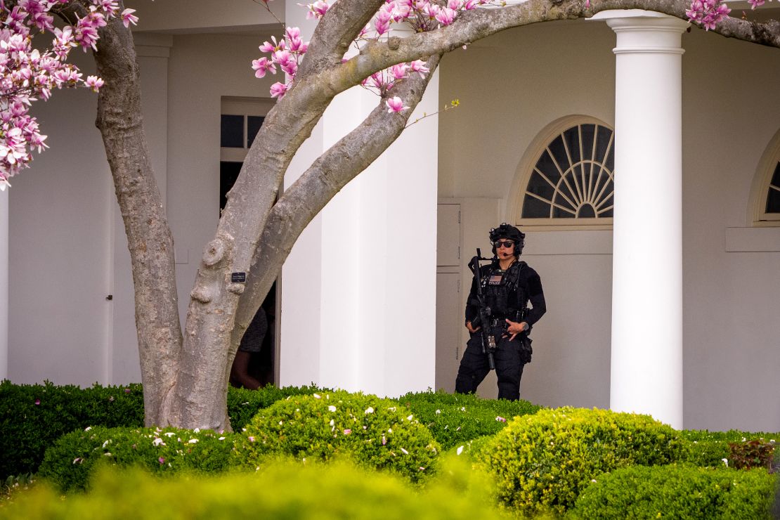 A member of the Secret Service Counter Assault Team stands along the colonnade before President Donald Trump departs the White House on March 28, in Washington, DC.