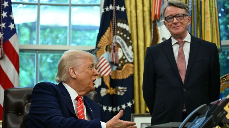 President Donald Trump shakes hands with British ambassador to the United States Peter Mandelson after making a trade announcement in the Oval Office of the White House in Washington, DC, on May 8.