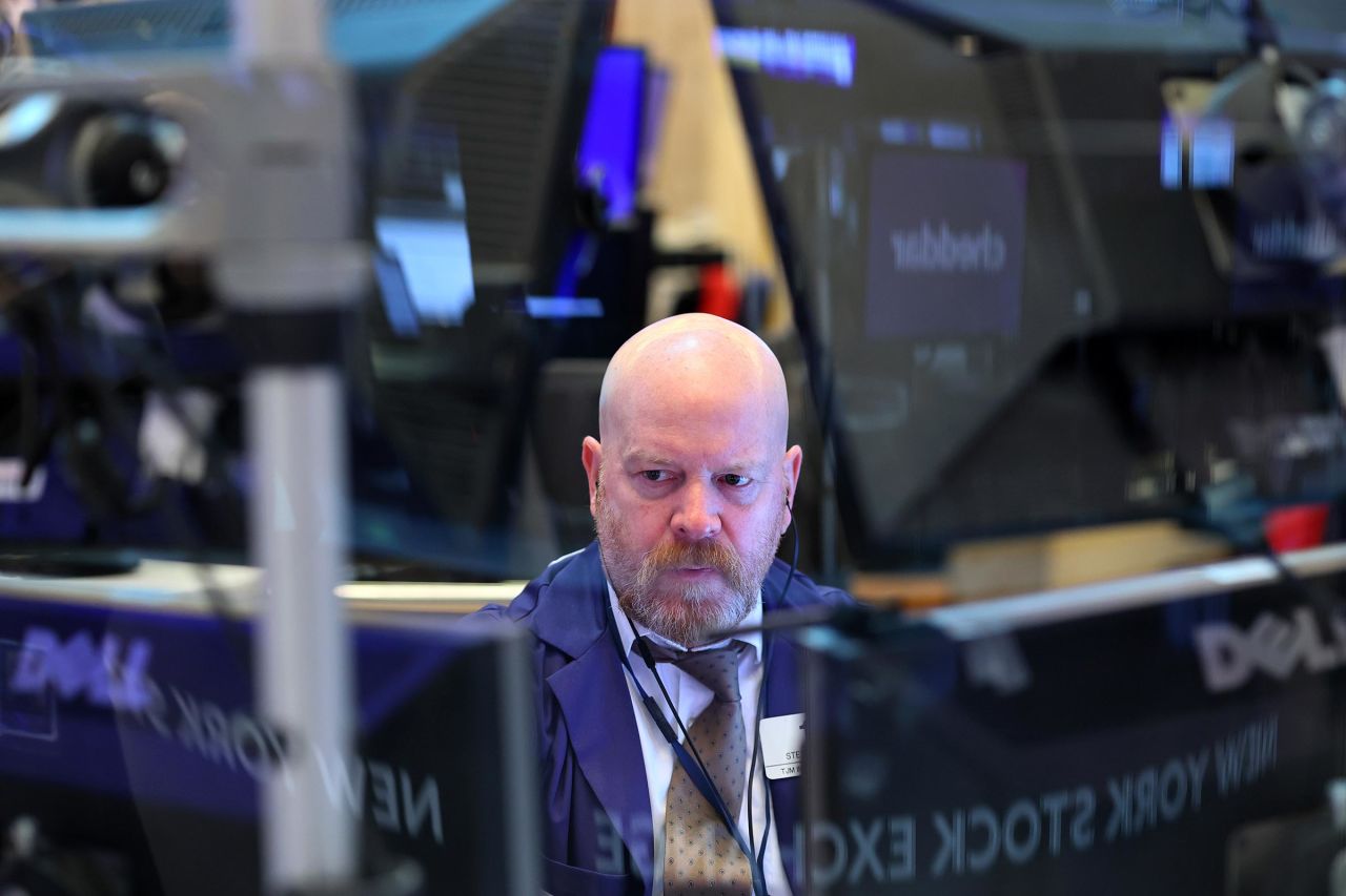 Traders work on the floor of the New York Stock Exchange during morning trading on May 7 in New York City.