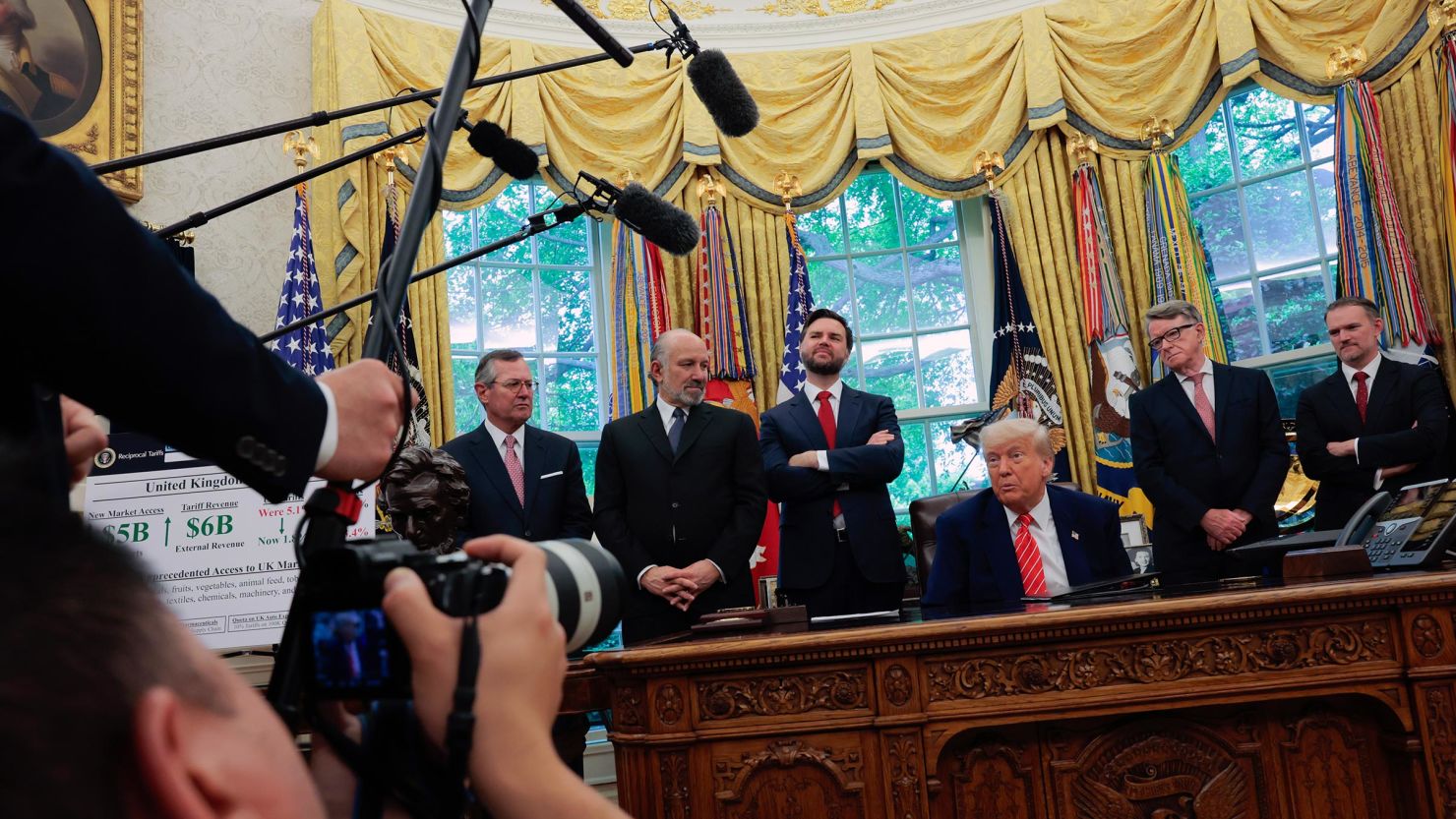President Donald Trump along with US Secretary of Commerce Howard Lutnick, Vice President JD Vance, Peter Mandelson, British Ambassador to the United States and US Trade Representative Jamieson Greer address reporters in the Oval Office at the White House on May 8 in Washington, DC.