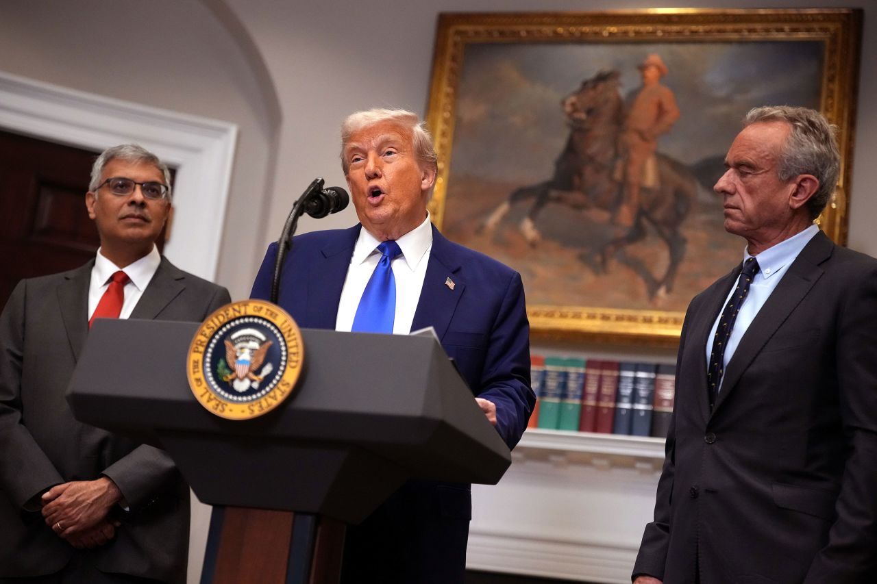 President Donald Trump, joined by National Institutes of Health (NIH) Director Jay Bhattacharya and Health and Human Services Secretary Robert F. Kennedy Jr., speaks during a press conference in the Roosevelt Room of the White House on May 12, in Washington, DC.