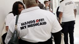 Protestors wearing "Hands Off Medicad" shirts line up outside of the Energy And Commerce Committee Markup Of Budget Reconciliation Hearing on May 13 in Washington, DC.