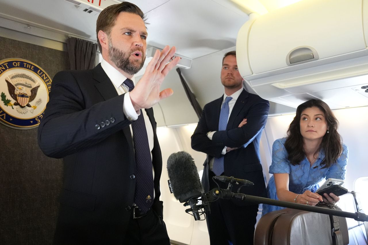 US Vice President JD Vance talks to reporters on board Air Force Two at Leonardo da Vinci International Airport on May 19, 2025 in Rome, Italy.