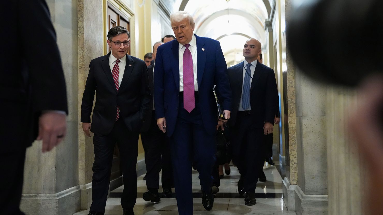 President Donald Trump arrives with House Speaker Mike Johnson for a House Republican meeting at the US Capitol on May 20 in Washington, DC.