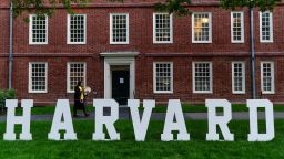 A students walks past a display on the Harvard University campus in Cambridge, Massachusetts, on May 27.
