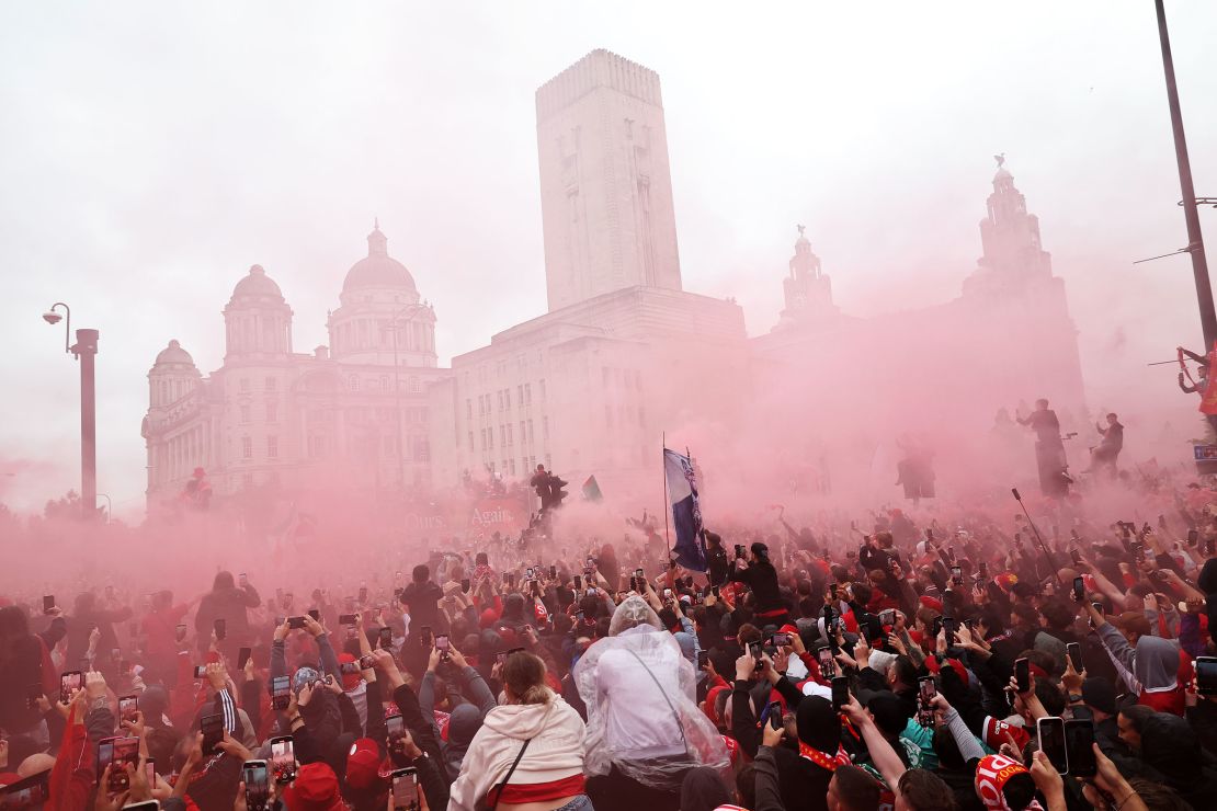 The Liverpool team bus passes by as fans gather during the Liverpool Trophy Parade on May 26 in Liverpool, England.