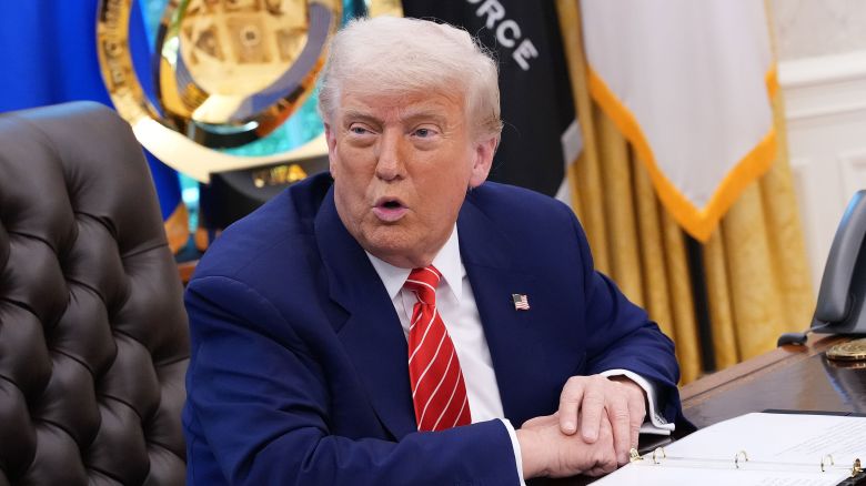 President Donald Trump speaks to reporters in the Oval Office of the White House on May 30.