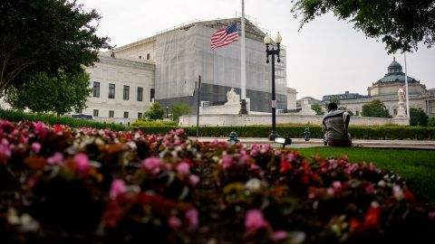 A person rests in front of the US Supreme Court on June 5 in Washington, DC.