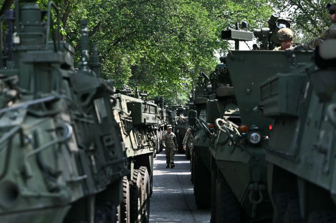 A US Army soldier walks between Stryker armored vehicles during a media preview at West Potomac Park in Washington, DC on Wednesday.