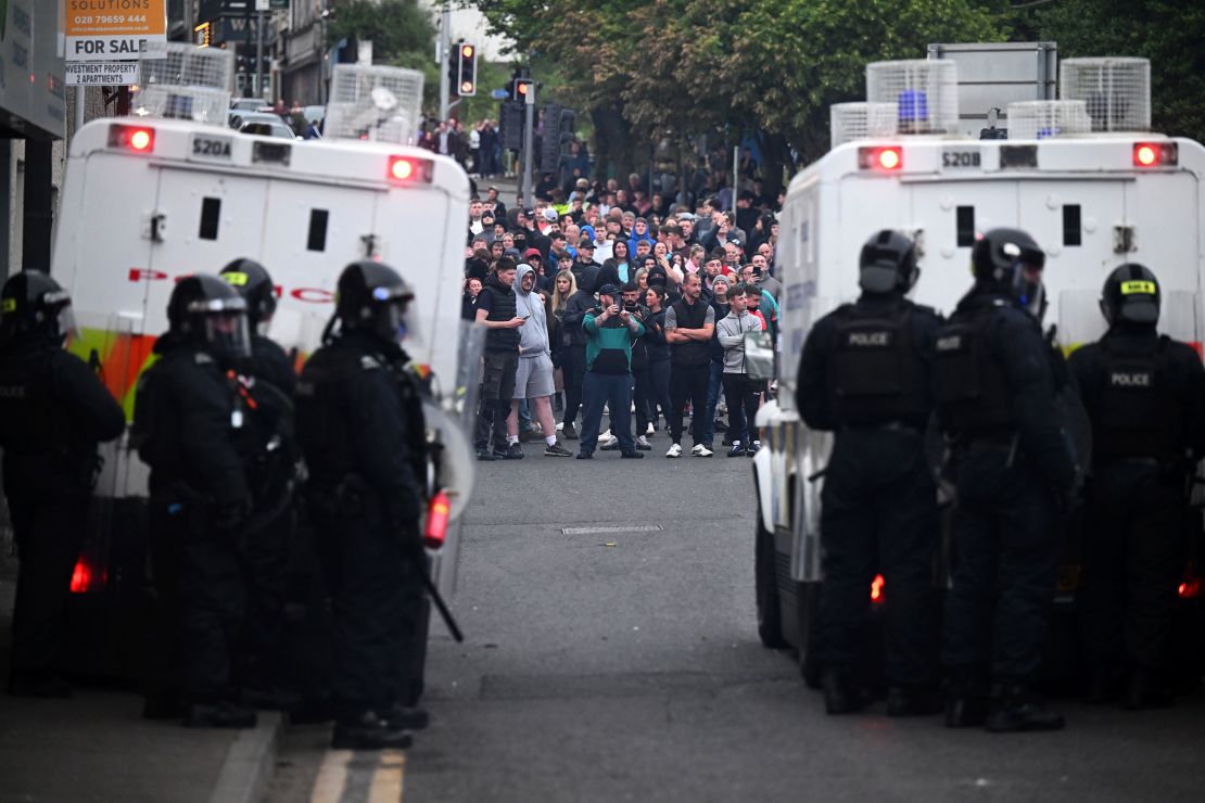 PSNI riot squad officers form a blockade near Harryville bridge to stop potential rioters from accessing the Clonavon terrace area on June 11 in Ballymena, Northern Ireland.