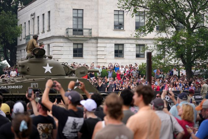 Spectators photograph a tank during the US Army's 250th Anniversary Parade in Washington, DC, US, on Saturday, June 14, 2025. 