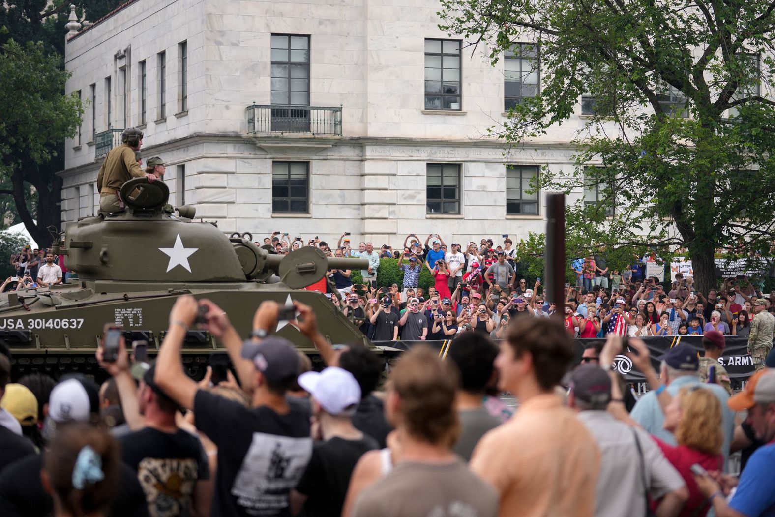 Spectators photograph a tank during the US Army's 250th Anniversary Parade in Washington, DC, US, on Saturday, June 14, 2025. 