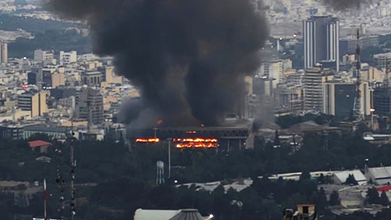 Smoke rises after a reported Israeli strike on a building used by Islamic Republic of Iran News Network, part of Iran's state TV broadcaster, on June 16, in Tehran, Iran.