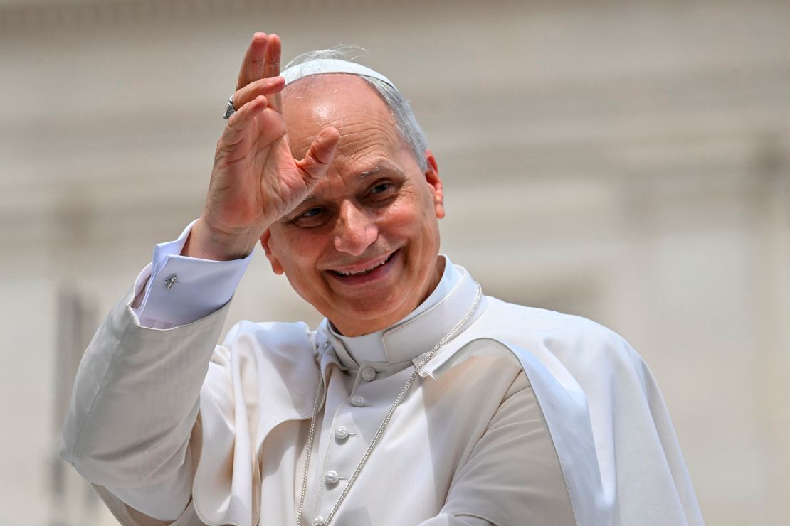 Pope Leo XIV waves to the crowd at the end of a weekly general audience at St. Peter's Square in The Vatican on June 18.
