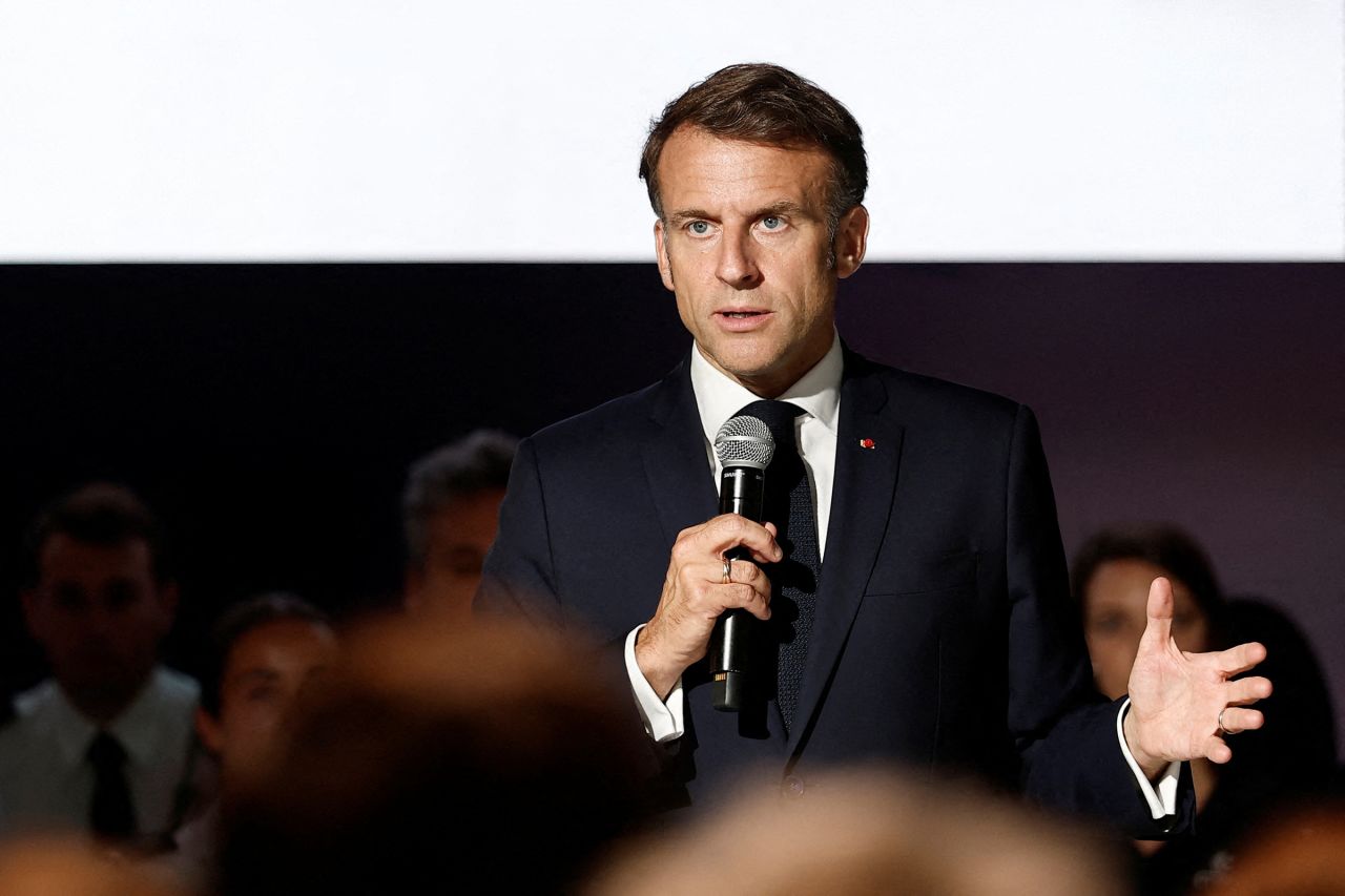 French President Emmanuel Macron delivers a speech at the Paris Space Hub stand during a visit to the 55th edition of the International Paris Air Show in Le Bourget, north of Paris, on June 20.