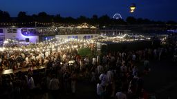 People attend France's annual street music festival, the Fete de la Musique, on the Seine river banks in Paris on June 21.