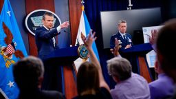 US Defense Secretary Pete Hegseth, accompanied by Chairman of the Joint Chiefs of Staff Air Force Gen. Dan Caine, takes a question from a reporter during a news conference at the Pentagon on June 22, in Arlington, Virginia.