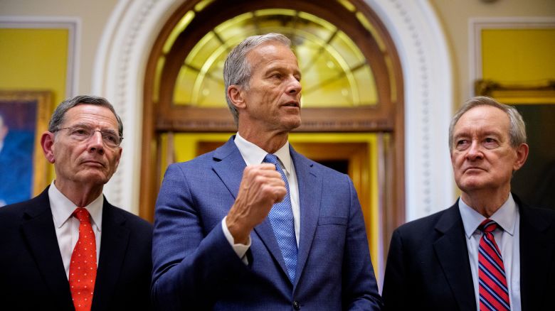 Senate Majority Leader John Thune, accompanied by Sen. John Barrasso and Sen. Mike Crapo, speaks to reporters off the Senate floor after the Senate passes President Donald Trump's so-called "One, Big, Beautiful Bill," Act at the US Capitol Building on July 1, in Washington, DC.