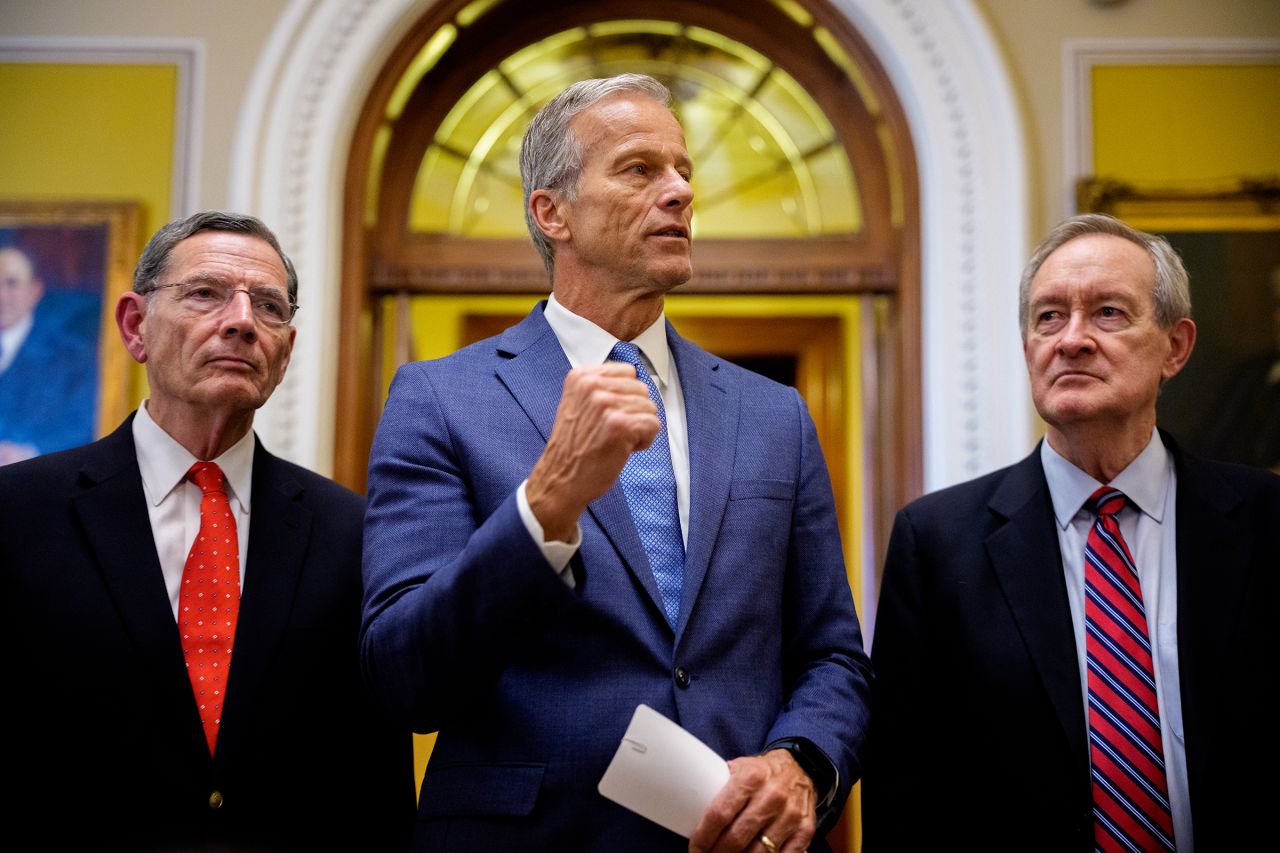 Senate Majority Leader John Thune, accompanied by Sen. John Barrasso and Sen. Mike Crapo, speaks to reporters off the Senate floor after the Senate passes President Donald Trump's so-called "One, Big, Beautiful Bill," Act at the US Capitol Building on July 1, in Washington, DC.