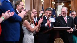House Speaker Mike Johnson, center, alongside Republican lawmakers, shows the final tally of the vote on US President Donald Trump's tax bill, One, Big, Beautiful Bill Act during a press conference US Capitol in Washington, DC, on July 3.