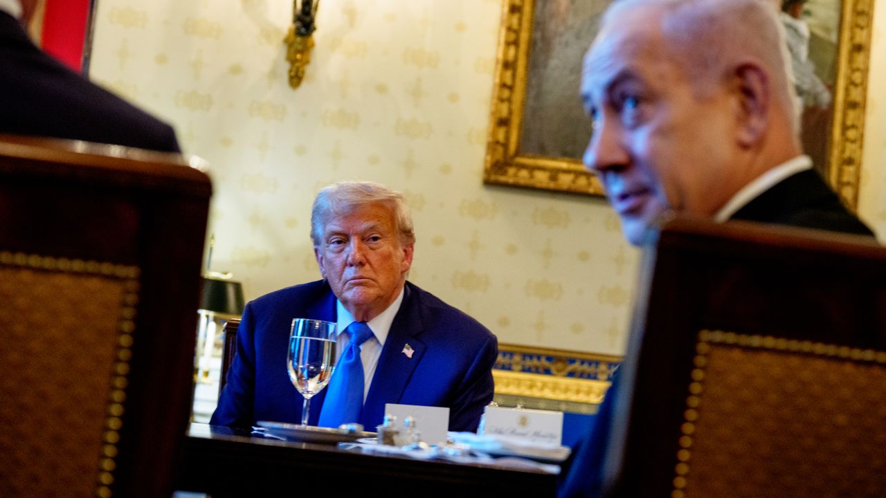 Israeli Prime Minister Benjamin Netanyahu, right, speaks during a dinner in the Blue Room of the White House with US President Donald Trump on July 7 in Washington, DC. 