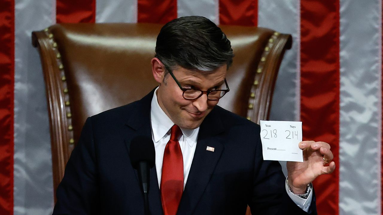 House Speaker Mike Johnson holds up the final vote tally after Trump's massive domestic policy bill passed the House of Representatives at the US Capitol on July 3 in Washington, DC.