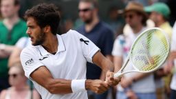 A black ribbon is worn by Francisco Cabral of Portugal as he plays a backhand during the Gentlemen's Doubles second round match against Petr Nouza of Czechia and Patrik Rikl of Czechia on day five of The Championships Wimbledon 2025 at All England Lawn Tennis and Croquet Club on July 4 in London.