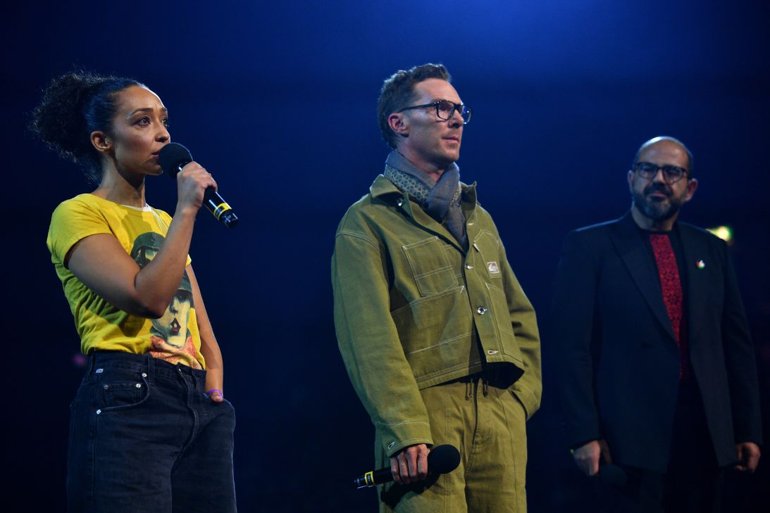 Ruth Negga, Benedict Cumberbatch and Amer Hlehel speak onstage during the Together For Palestine concert.