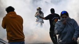 Residents and protesters clash with federal agents in Chicago's East Side neighborhood on October 14, 2025.