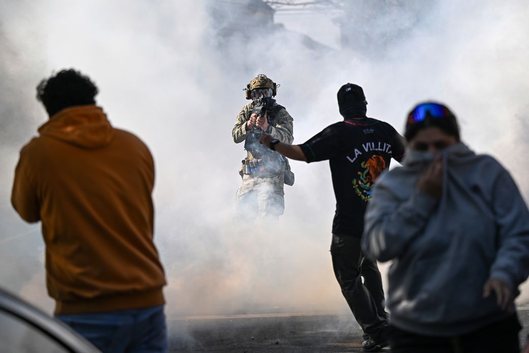 Residents and protesters clash with federal agents in Chicago's East Side neighborhood on October 14, 2025.