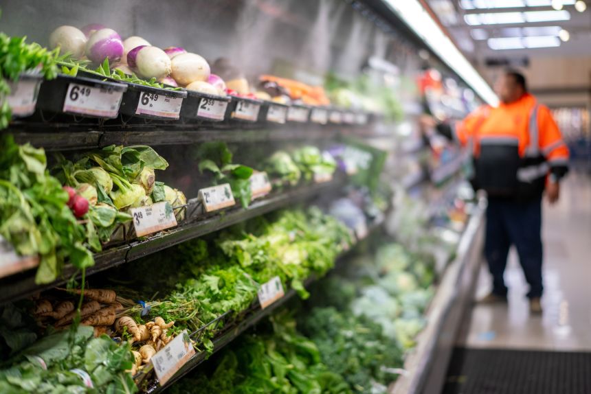 Misters spray produce at a grocery store in Dayton, Ohio, on October 21.