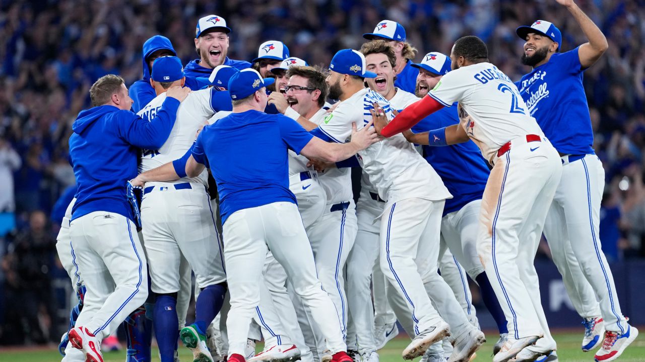 Toronto Blue Jays celebrate after defeating the Seattle Mariners in Game 7 of the American League Championship Series.