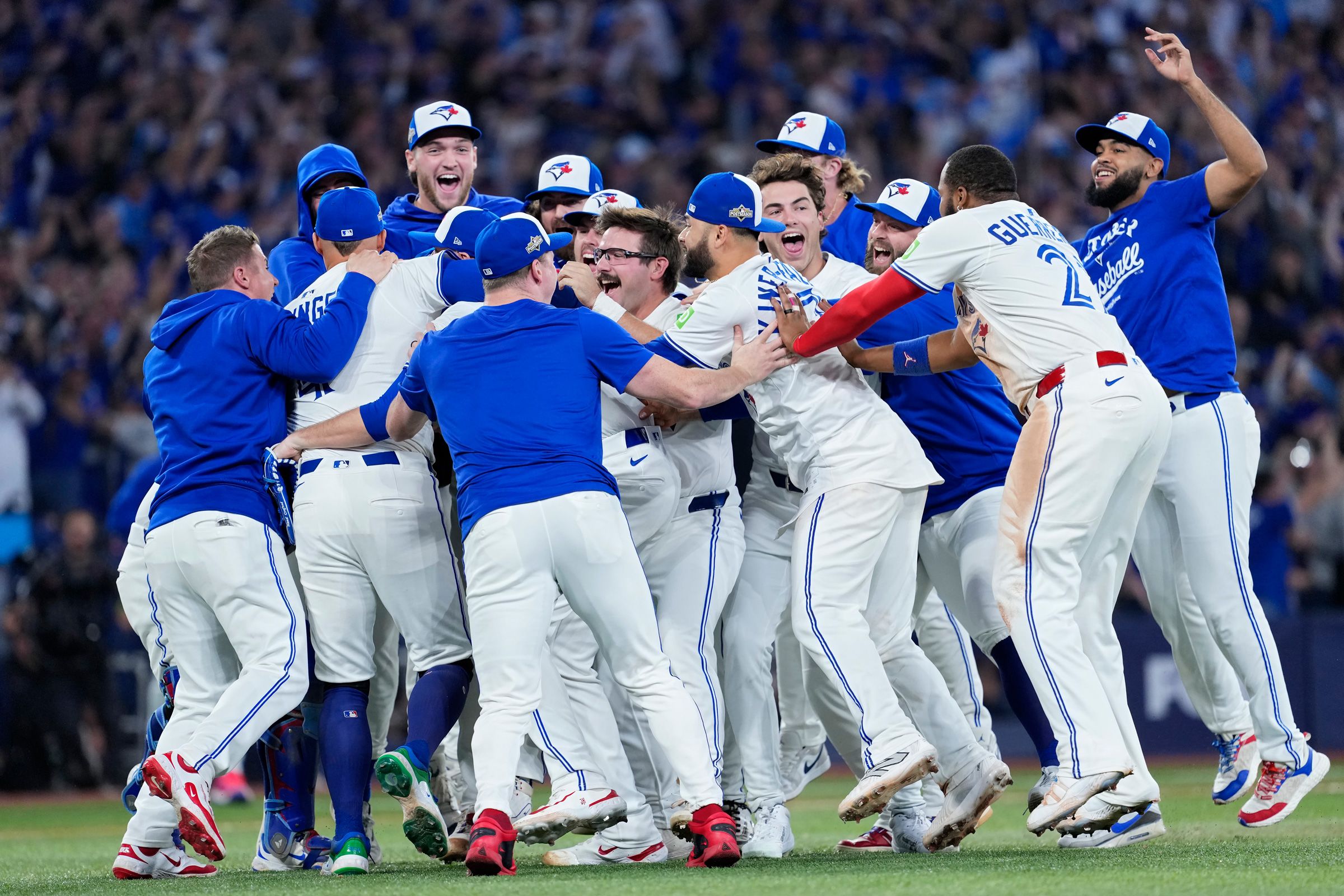 Toronto Blue Jays celebrate after defeating the Seattle Mariners in Game 7 of the American League Championship Series.