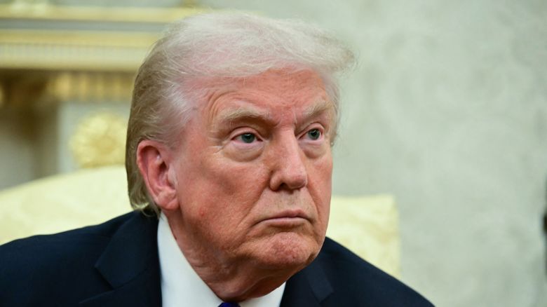 US President Donald Trump looks on during a meeting with NATO Secretary General Mark Rutte in the Oval Office of the White House in Washington, DC, on October 22, 2025.