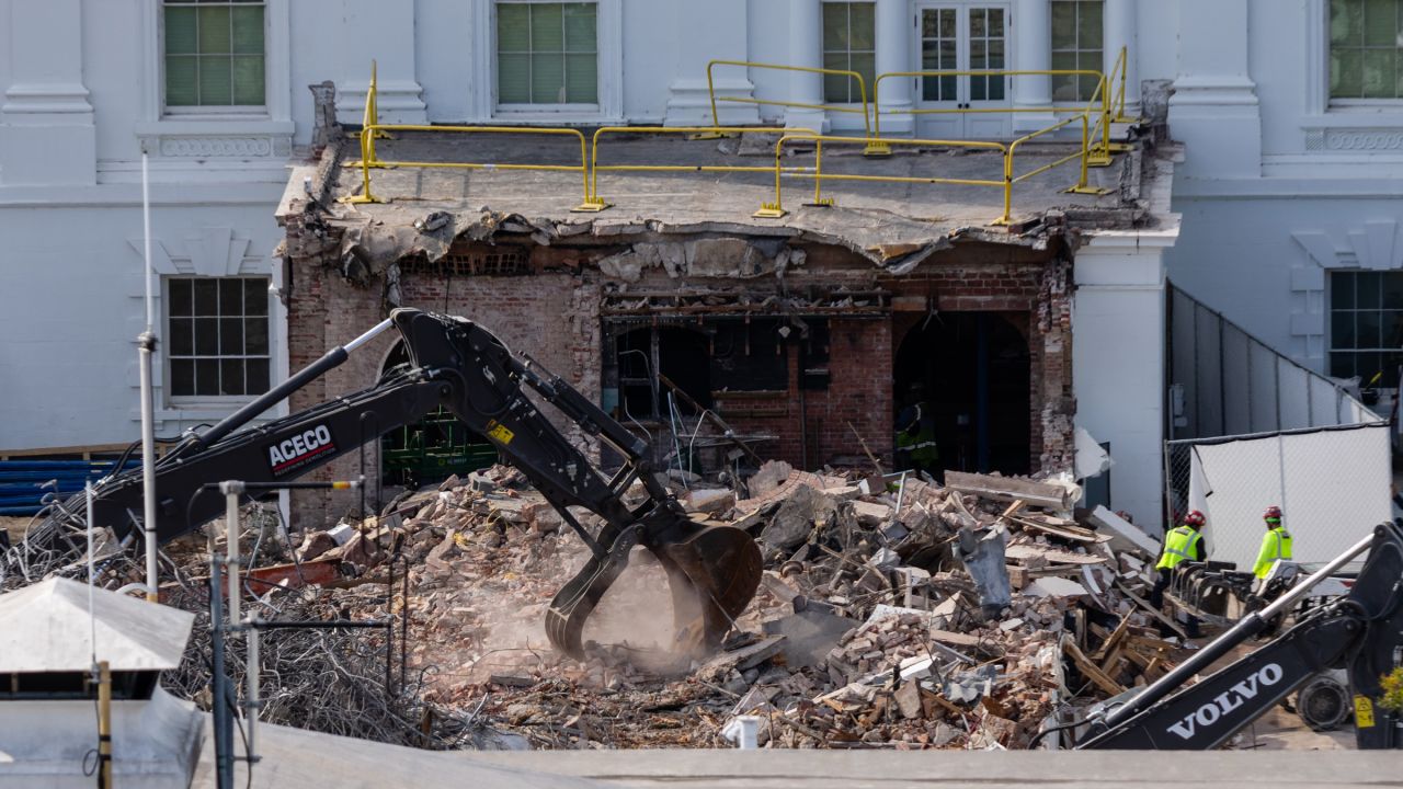 An excavator works to clear rubble after the East Wing of the White House was demolished on October 23, 2025 in Washington, DC. The demolition is part of U.S. President Donald Trump's plan to build a ballroom reportedly costing at least $250 million on the eastern side of the White House.