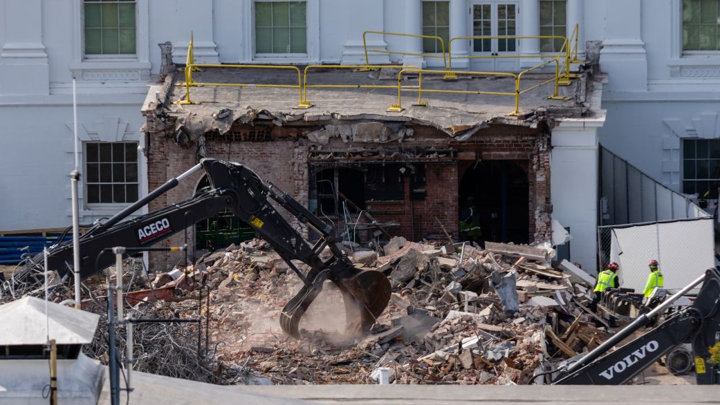An excavator works to clear rubble after the East Wing of the White House was demolished on October 23, 2025 in Washington, DC. The demolition is part of U.S. President Donald Trump's plan to build a ballroom reportedly costing at least $250 million on the eastern side of the White House.