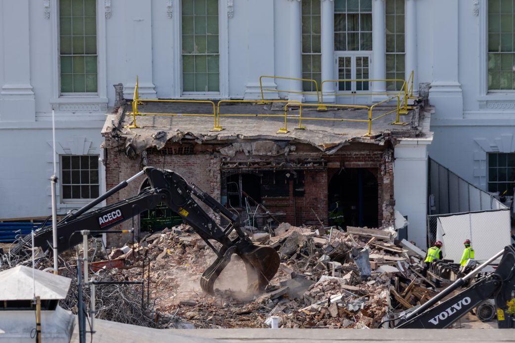 An excavator works to clear rubble after the East Wing of the White House was demolished on Thursday, in Washington, DC.