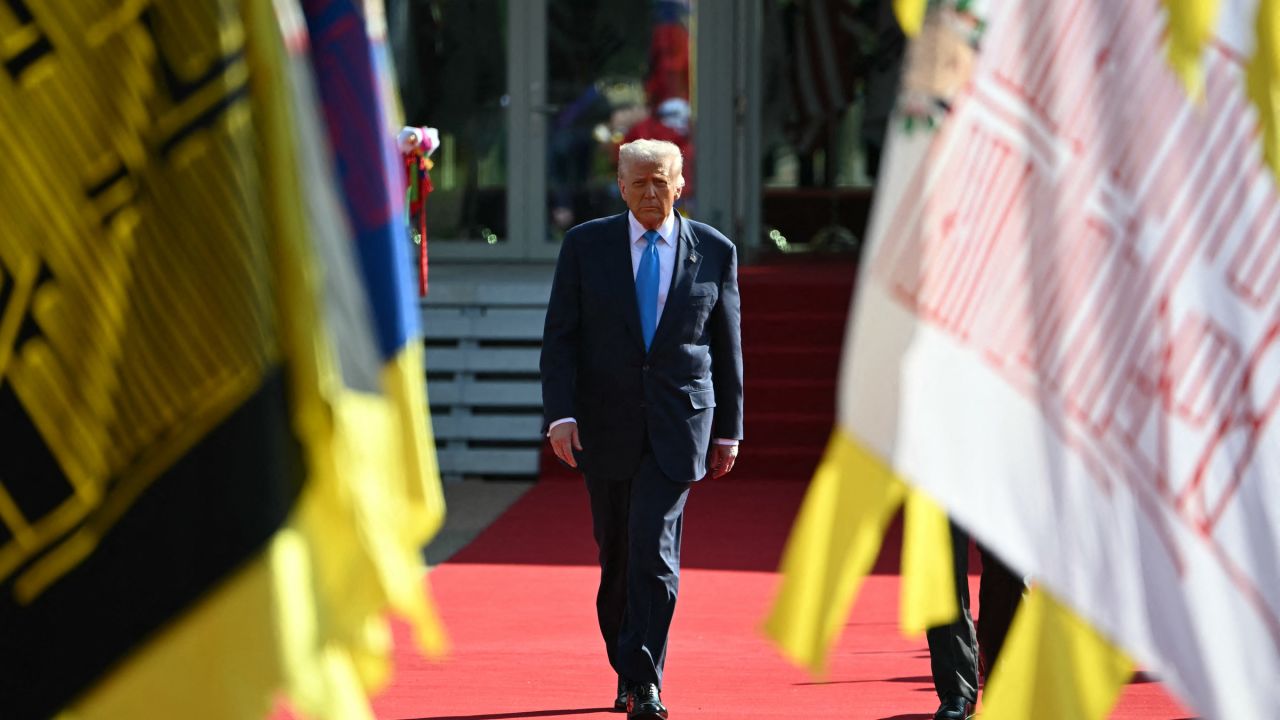 US President Donald Trump walks with South Korean President Lee Jae Myung after a high honor presentation ceremony at the Gyeongju National Museum in Gyeongju on Wednesday.