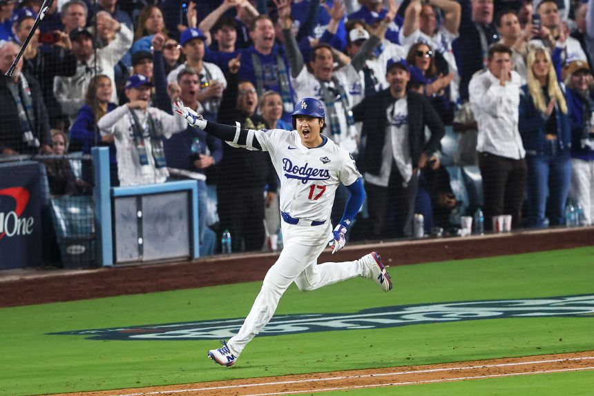 Shohei Ohtani celebrates after hitting his second home run of World Series Game 3 in Los Angeles.