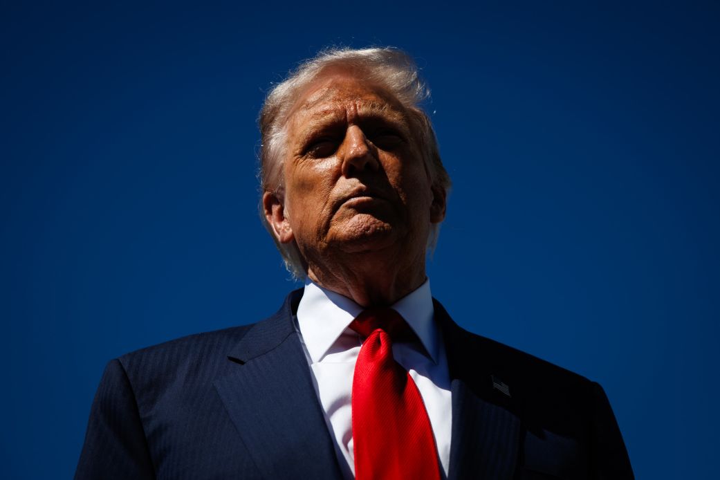 President Donald Trump speaks to reporters as he arrives at Palm Beach International Airport on October 31 in West Palm Beach, Florida.